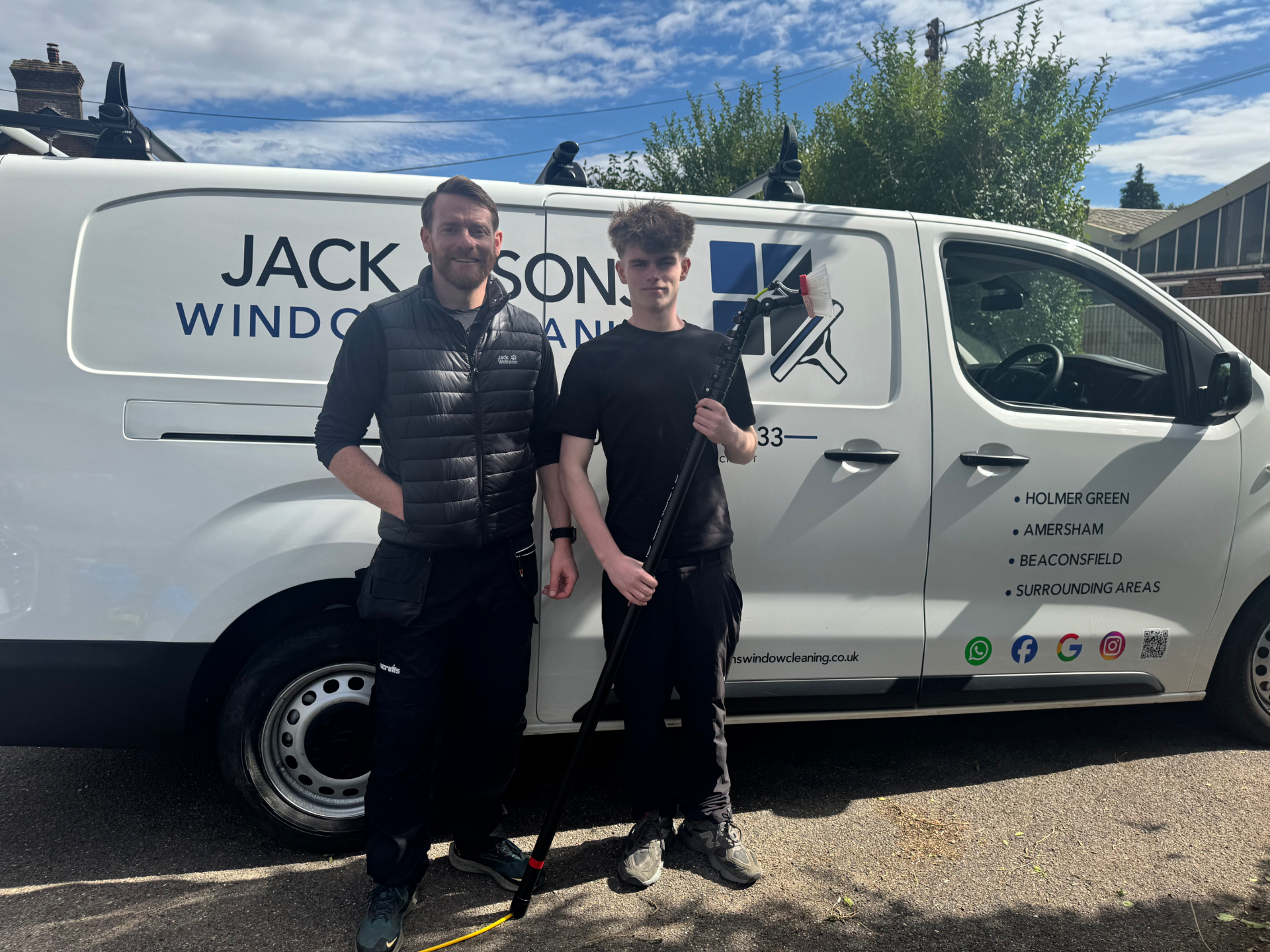 Jack and his eldest son, family-run window cleaners, beside the branded Jack & Sons Window Cleaning van in Holmer Green, Buckinghamshire
